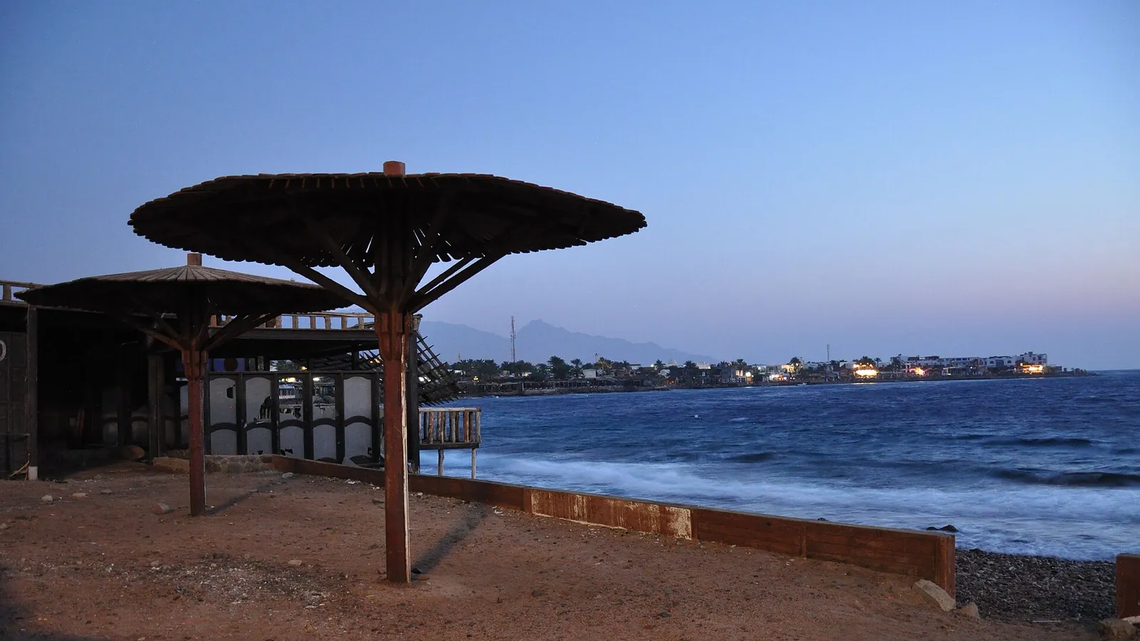 Dahab's Masbat Bay at dusk on the Gulf of Aqaba, Sinai mountains behind